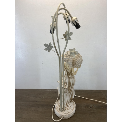 587 - A resin figural table lamp in the form of a lady