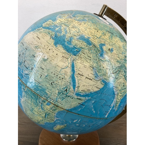 597 - A terrestrial globe on teak plinth