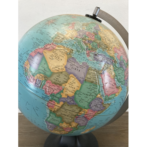 598 - A terrestrial globe on plastic base