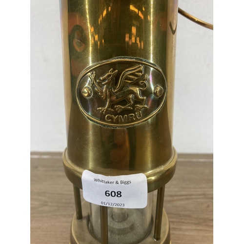 608 - A vintage Welsh brass miner's lamp