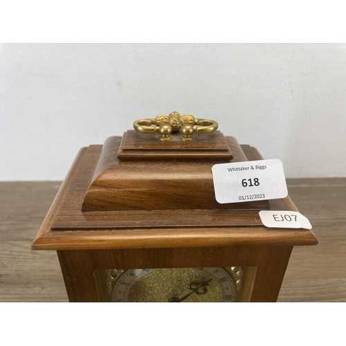 618 - A Thwaites & Reed walnut cased mantel clock with key