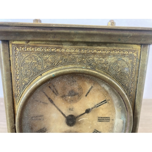 619 - An antique Seth Thomas engraved brass carriage clock