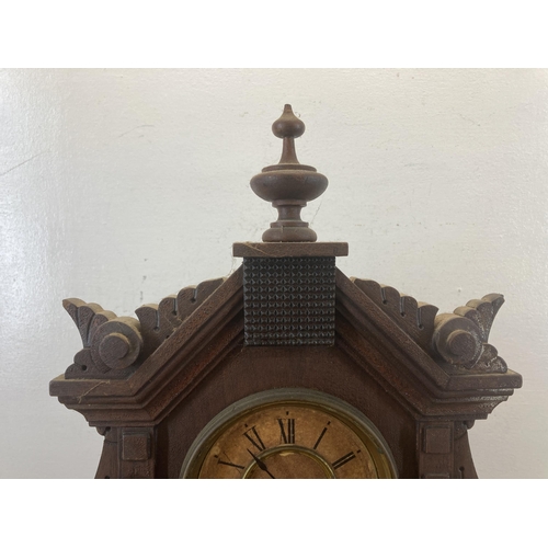 623 - An early 20th century Ansonia Clock Co. heavily carved mahogany cased chiming mantel clock