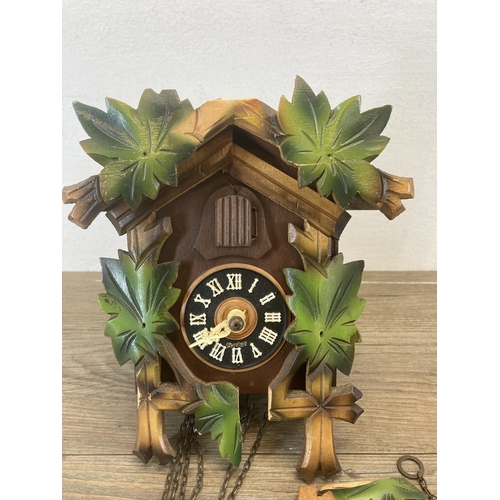 629 - A Sugesa heavily carved cuckoo clock