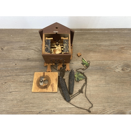 629 - A Sugesa heavily carved cuckoo clock