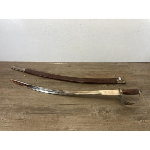 639 - An Indian Sabre sword with oak handle and leather sheath