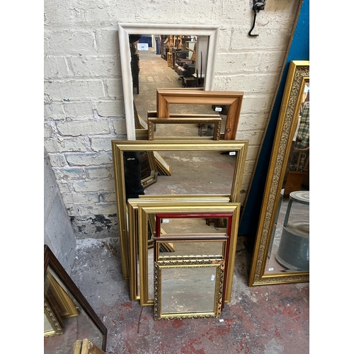 260 - Nine framed wall mirrors to include gilt, pine etc. - largest approx. 123cm x 35cm