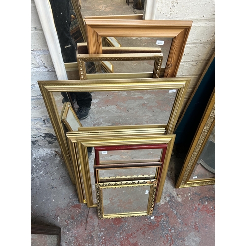 260 - Nine framed wall mirrors to include gilt, pine etc. - largest approx. 123cm x 35cm