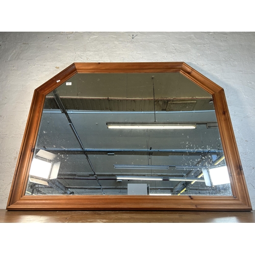 265 - A pine framed wall mirror - approx. 107cm high x 135cm wide