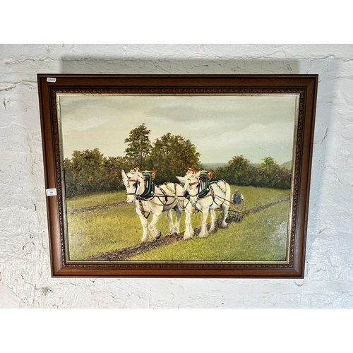 269 - A 20th century mahogany framed oil on board of a horse ploughing scene - approx. 62cm high x 80cm wi... 