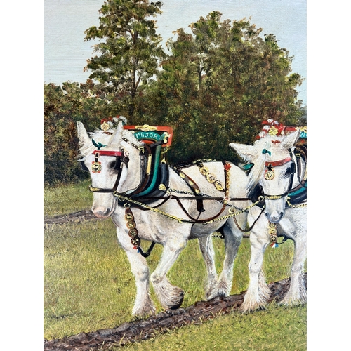 269 - A 20th century mahogany framed oil on board of a horse ploughing scene - approx. 62cm high x 80cm wi... 