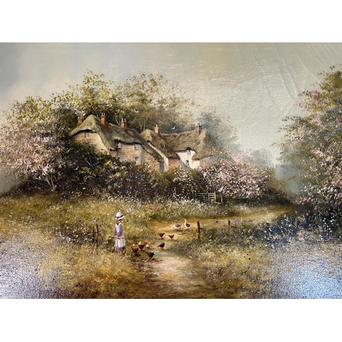 289 - A gilt framed Les Parson thatched cottage scene oil on canvas - approx. 64cm high x 90cm wide