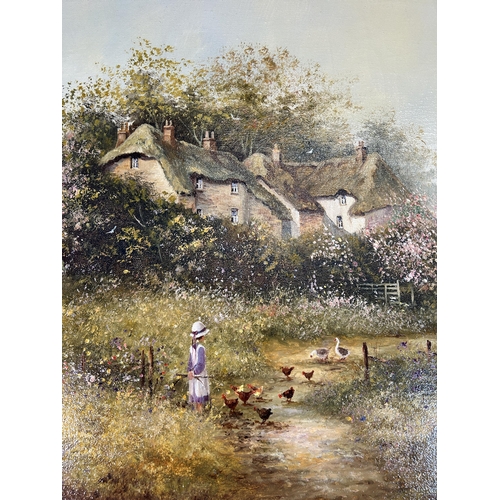 289 - A gilt framed Les Parson thatched cottage scene oil on canvas - approx. 64cm high x 90cm wide