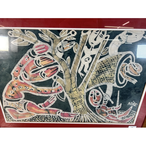 296 - A framed Nike Davies-Okundaye batik - approx. 56cm high x 75cm wide