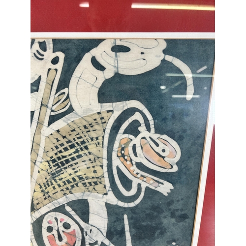 296 - A framed Nike Davies-Okundaye batik - approx. 56cm high x 75cm wide