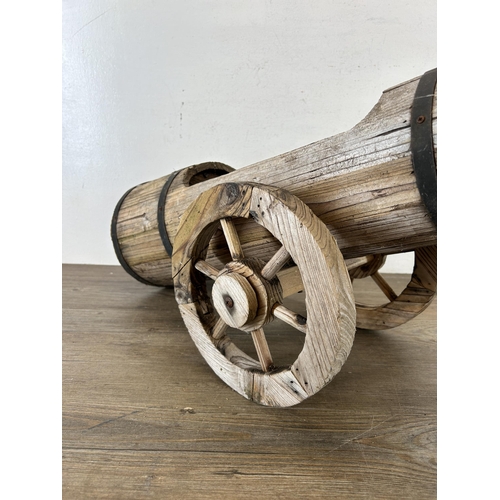 641 - A hardwood planter in the form of a cannon