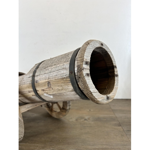 641 - A hardwood planter in the form of a cannon