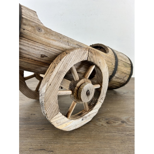 641 - A hardwood planter in the form of a cannon