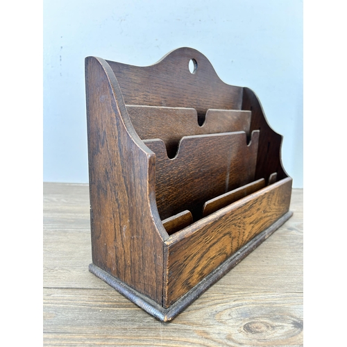 644 - An early 20th century oak four section letter rack