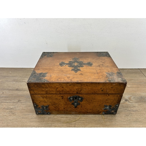 648 - A 19th century walnut and metal bound storage box