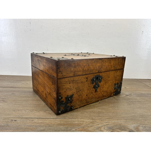 648 - A 19th century walnut and metal bound storage box