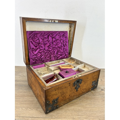 648 - A 19th century walnut and metal bound storage box