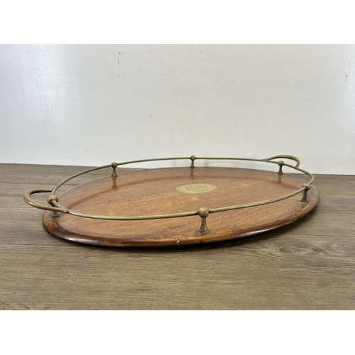 649 - An early 20th century oak and EPNS twin serving tray - approx. 63cm long x 41cm deep