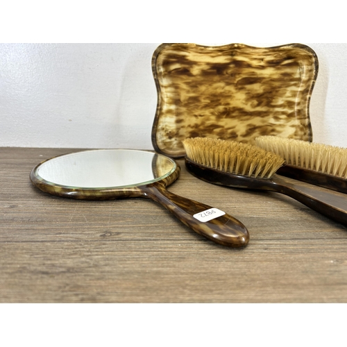 650 - A six piece tortoise shell effect dressing table set