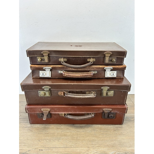 669 - Four vintage leather suitcases containing assorted masonic regalia