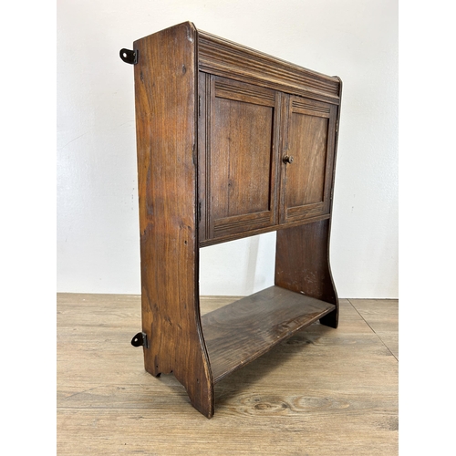 675 - An Edwardian oak wall mountable two door cabinet - approx. 59cm high x 43cm wide x 15cm deep