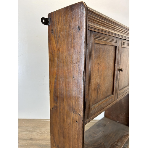 675 - An Edwardian oak wall mountable two door cabinet - approx. 59cm high x 43cm wide x 15cm deep