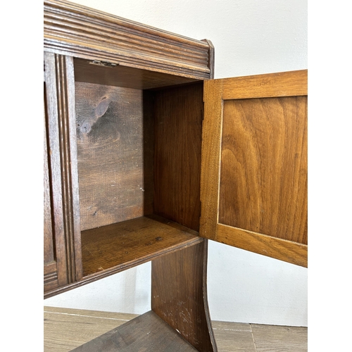 675 - An Edwardian oak wall mountable two door cabinet - approx. 59cm high x 43cm wide x 15cm deep