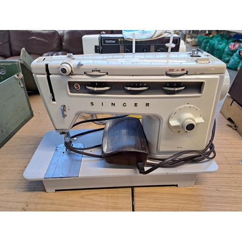 835 - A Singer 514 electric sewing machine with foot pedal