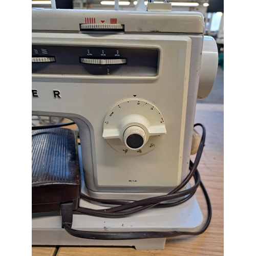 835 - A Singer 514 electric sewing machine with foot pedal