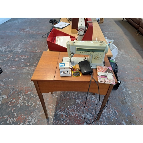 838 - A Singer 507 electric sewing machine with foot pedal, stand, accessories and instruction manual