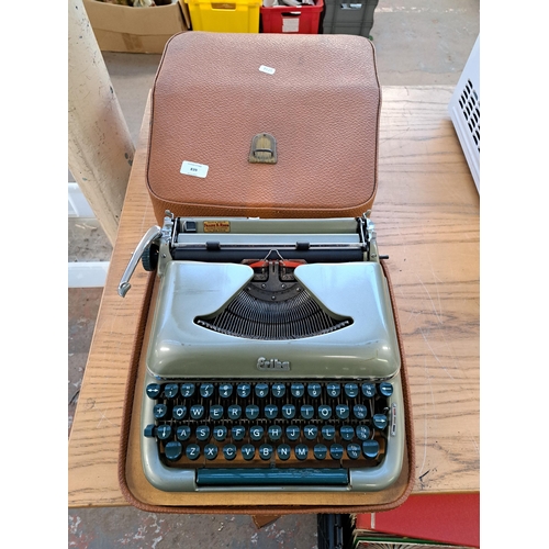 839 - A cased Erika model 10 portable typewriter