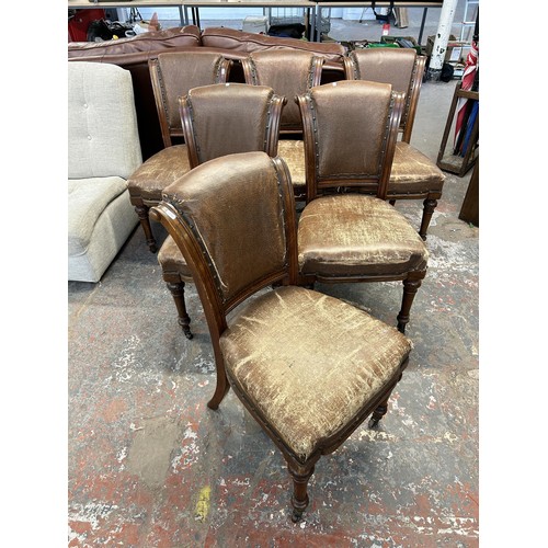 255 - Six 19th century carved oak and brown vinyl upholstered dining chairs