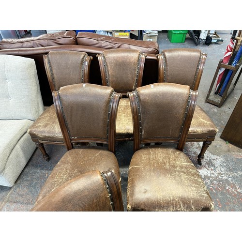 255 - Six 19th century carved oak and brown vinyl upholstered dining chairs