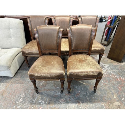 255 - Six 19th century carved oak and brown vinyl upholstered dining chairs