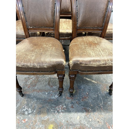 255 - Six 19th century carved oak and brown vinyl upholstered dining chairs