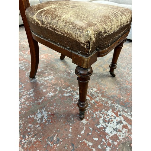 255 - Six 19th century carved oak and brown vinyl upholstered dining chairs