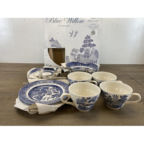 393 - A boxed Churchill blue willow twenty piece dinner service