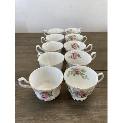 400 - A collection of Royal Albert Moss Rose bone china