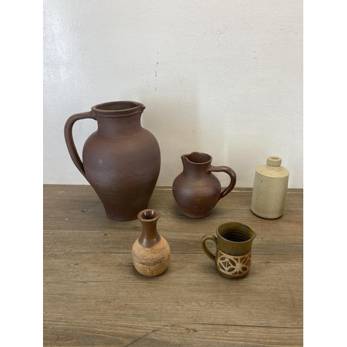 406 - A collection of studio pottery to include Lisa Larson style wall tile etc.