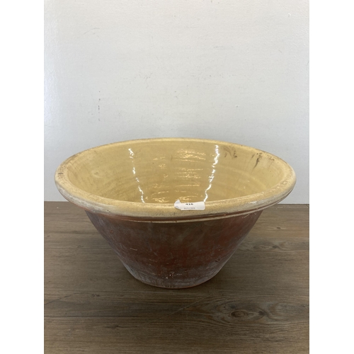 416 - A 19th century salt glazed terracotta dairy bowl - approx. 22cm high x 44cm diameter