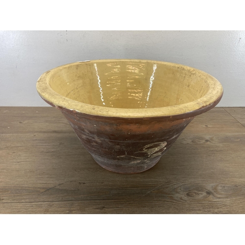 418 - A 19th century salt glazed terracotta dairy bowl - approx. 22cm high x 42cm diameter