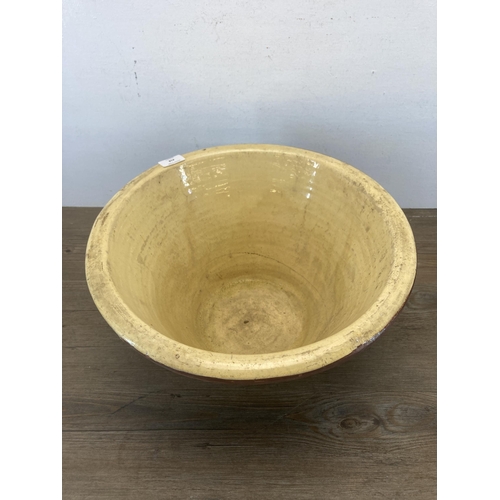 418 - A 19th century salt glazed terracotta dairy bowl - approx. 22cm high x 42cm diameter