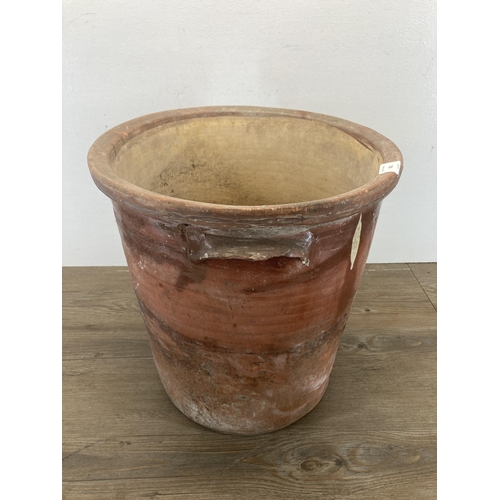 421 - A large 19th century glazed terracotta twin handled storage jar - approx. 38cm high x 37cm diameter