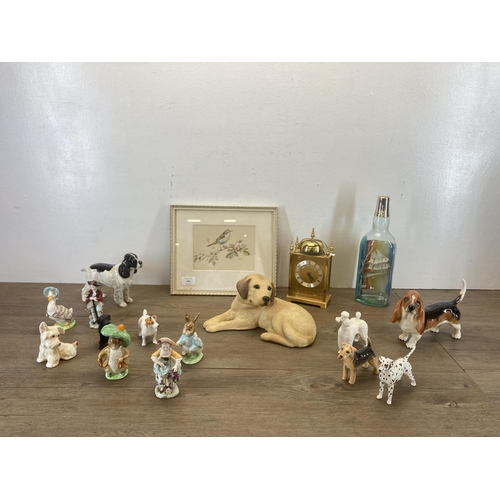 426 - A collection of items to include Schmeckenkecher Quartz mantel clock, six Beswick dog figurines, thr... 