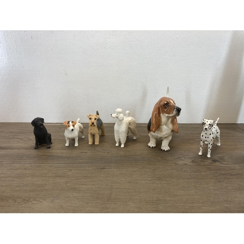 426 - A collection of items to include Schmeckenkecher Quartz mantel clock, six Beswick dog figurines, thr... 